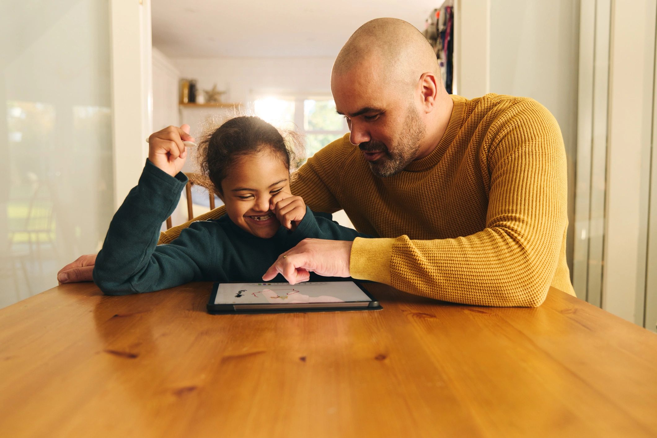 Parent and child using a tablet together