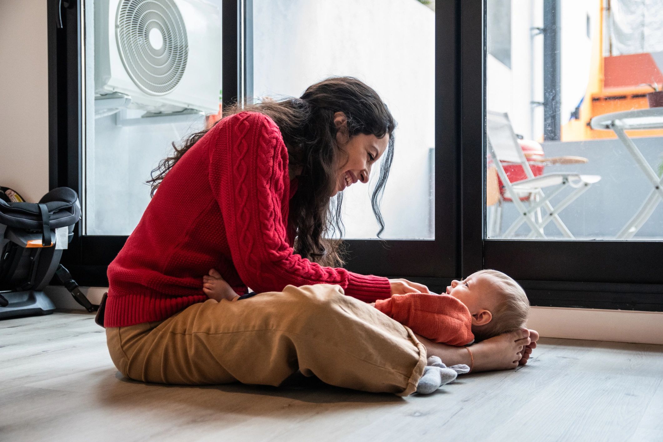 Parent with baby at home representing family care support
